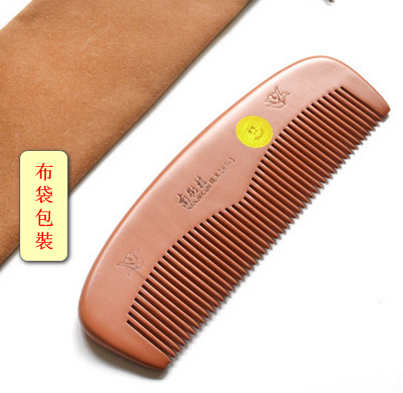 Popular large handleless peachwood comb with dense teeth (total length in cloth bag is about 16.5 cm)