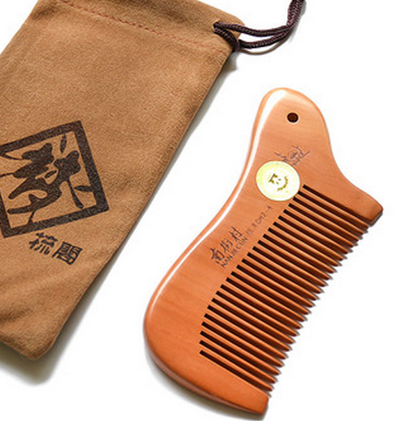 Popular peach wood comb for women (packaged in cloth bag) about 12 cm