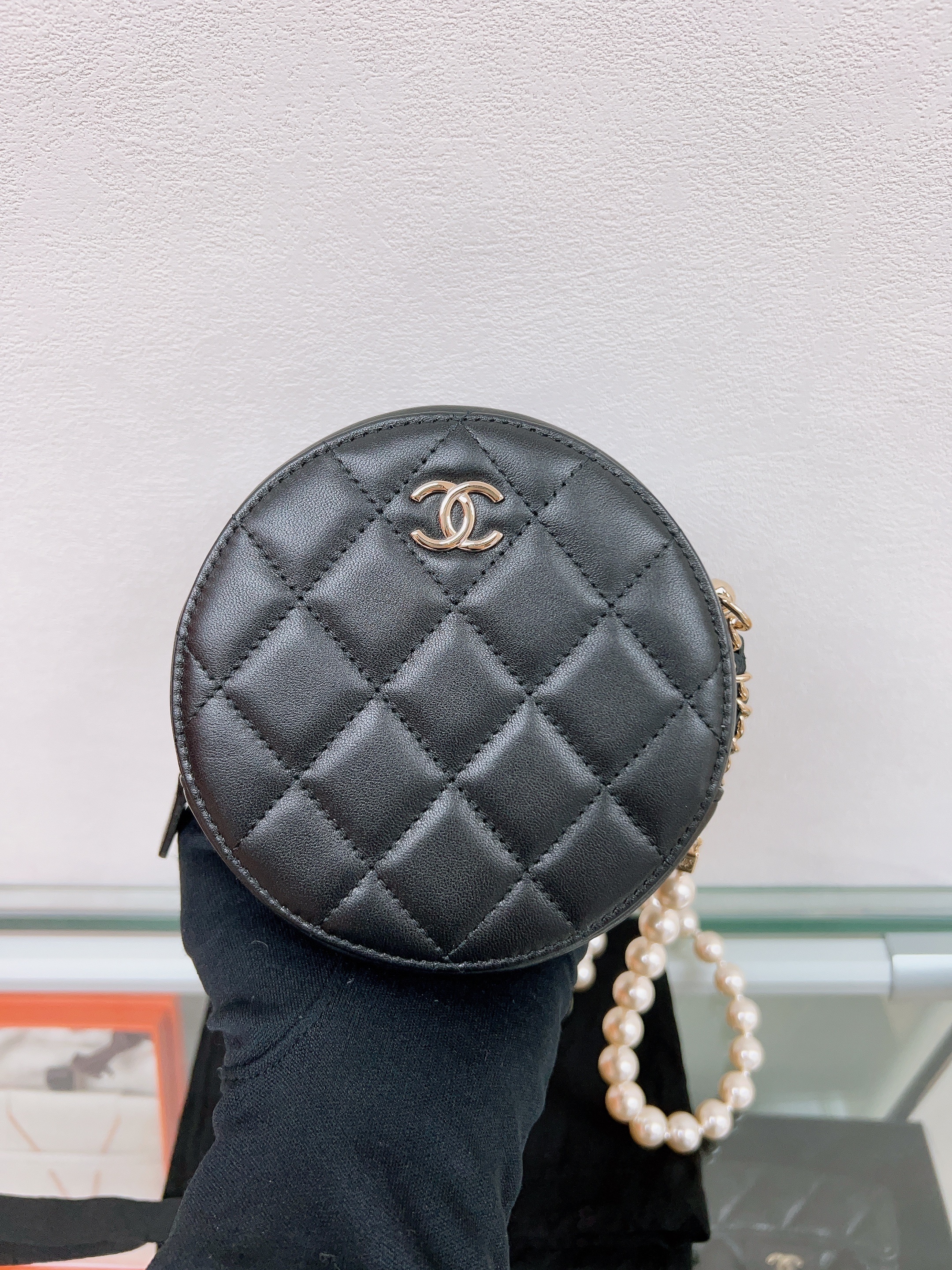 Chanel round bag with pearl chain (black lambskin)