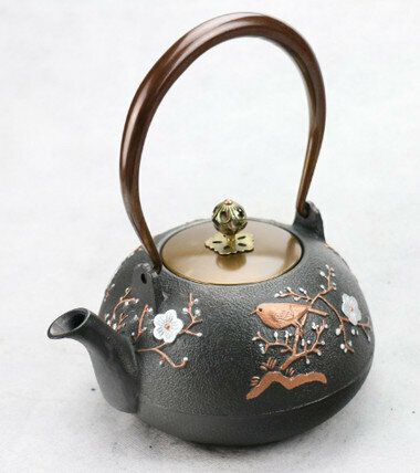 Hot push iron teapot (Specification: Cai Que Plum Blossom 1.0L)