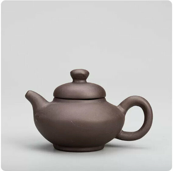 Popular simple purple sand fingertip teapot (black mud flat teapot)
