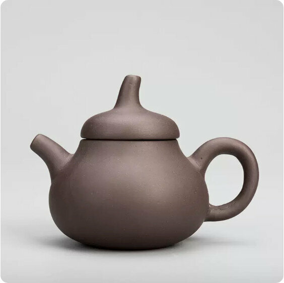 Popular simple purple sand fingertip teapot (black mud pumpkin teapot)