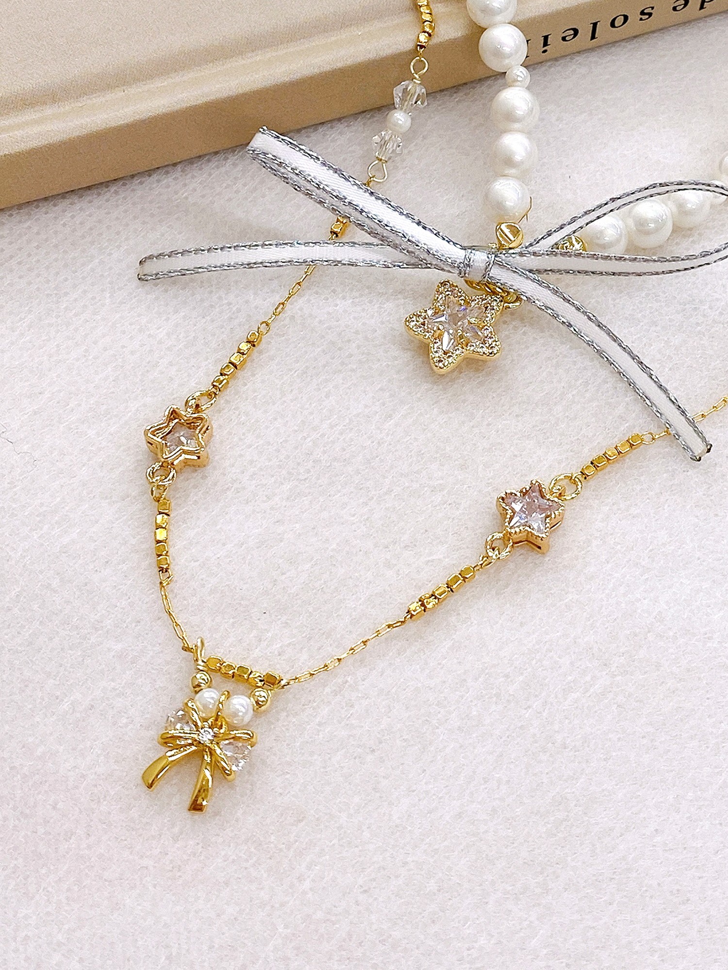 秘制巧脆餅。MUCHAT手作14+18KGP鋯石蝶結星星項鍊(不含星星珍珠項鍊)