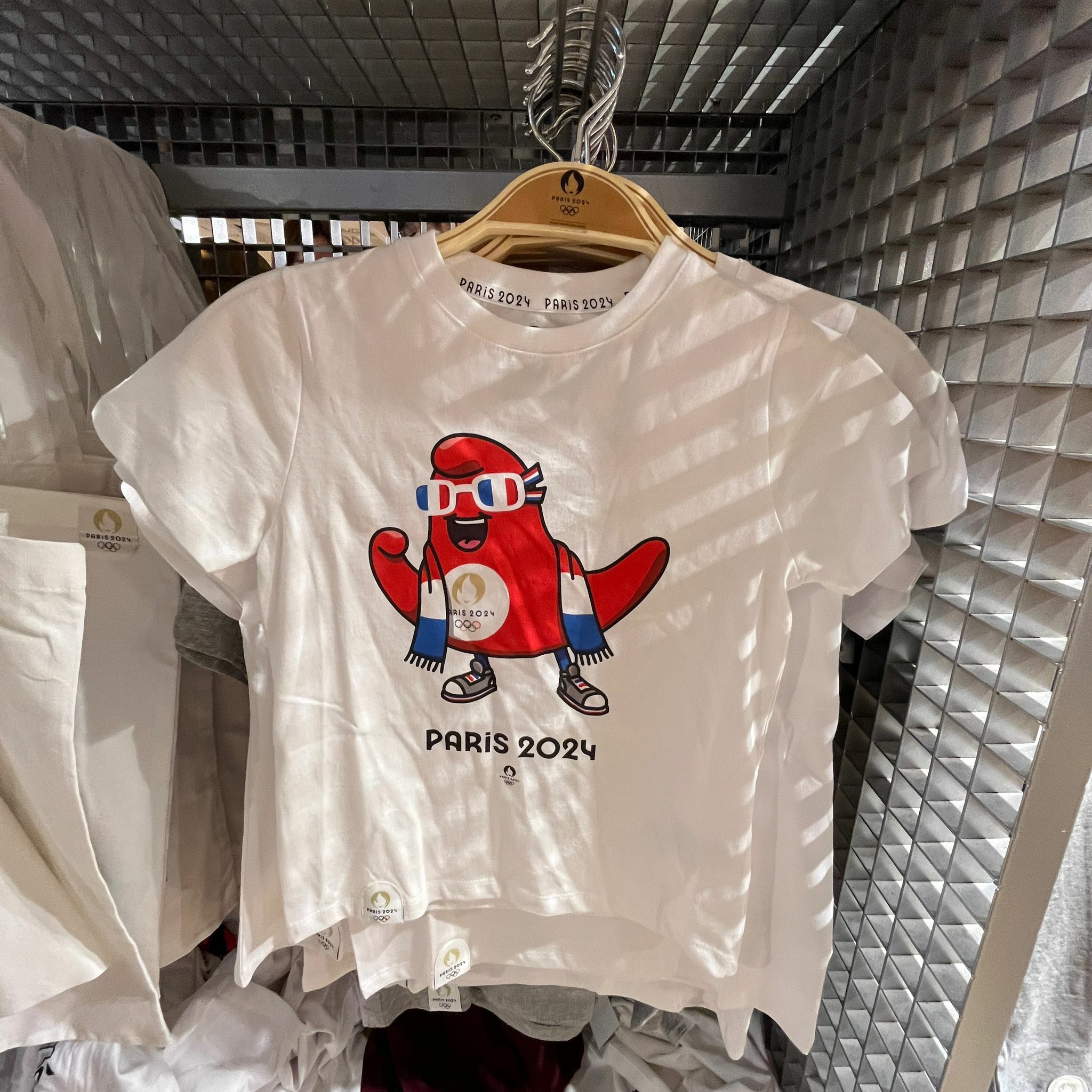 1EU0704-257 OLYMPICS Paris 2024 Olympics Mascot T-Shirt Kids White #BOJOMASTS023 (C-EU-E)