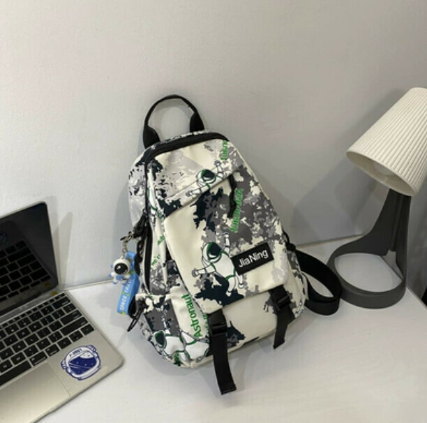 Popular crossbody bag for men, trendy canvas chest bag (black with astronaut pendant)