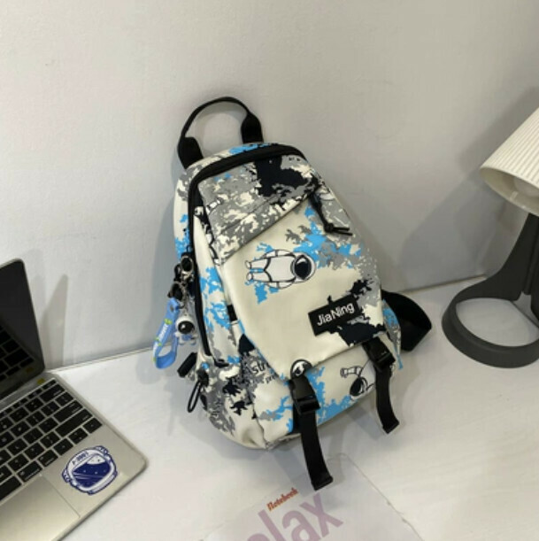 Popular crossbody bag for men, trendy canvas chest bag (blue with astronaut pendant)