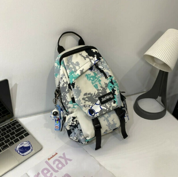 Popular crossbody bag for men, trendy canvas chest bag (green with astronaut pendant)