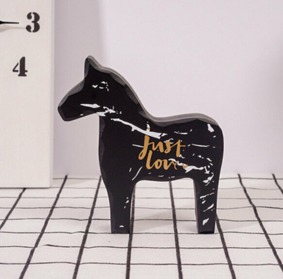 New decorative furnishings [small black wooden horse]