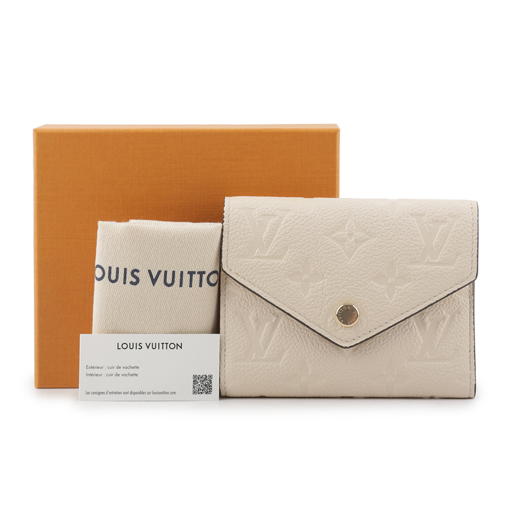 【Louis Vuitton / LV】Monogram VICTORINE牛皮壓印零錢袋短夾(奶油色) M82344