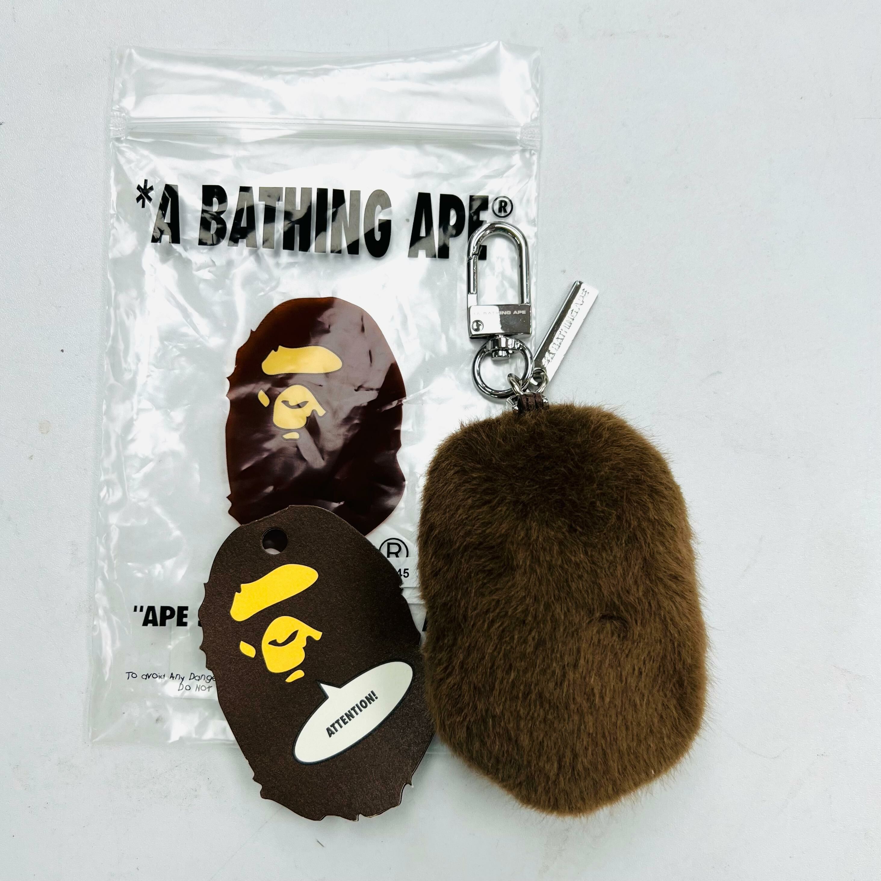 A BATHING APE® APE HEAD FAUX FUR KEYCHAIN