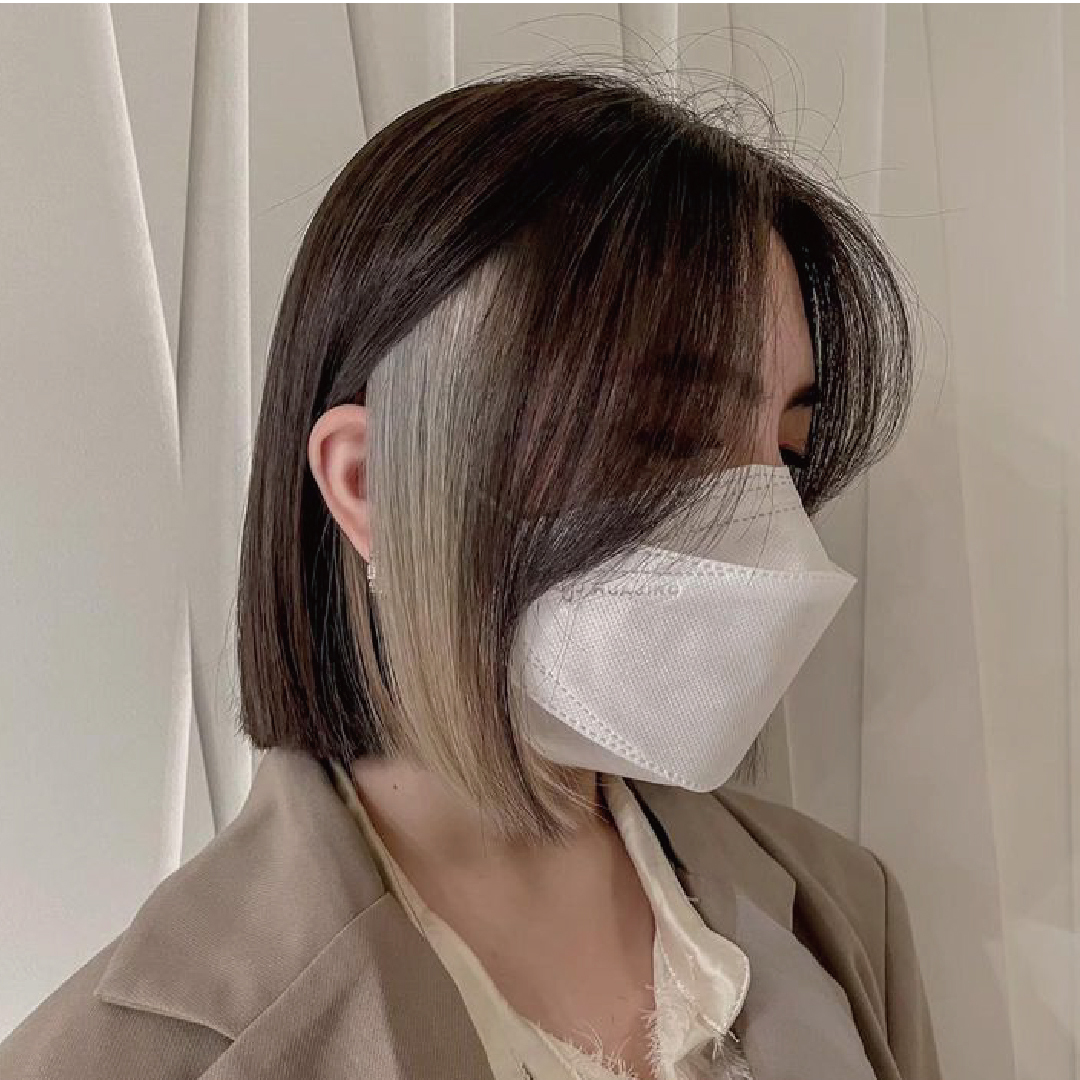 Black hair paired with platinum is the most high-key color combination. / Provided by Apple