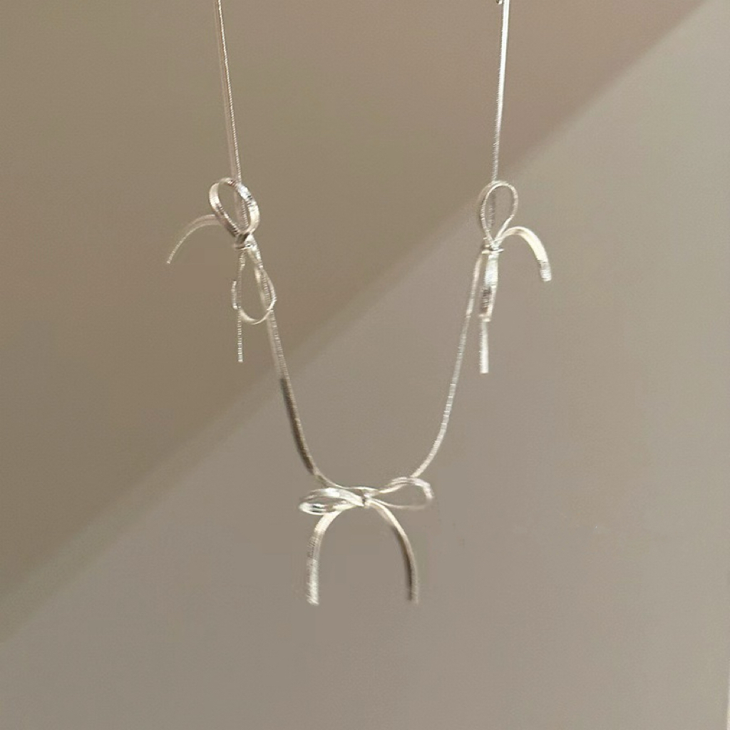 悸動．長款分布式蝴蝶結頸鏈