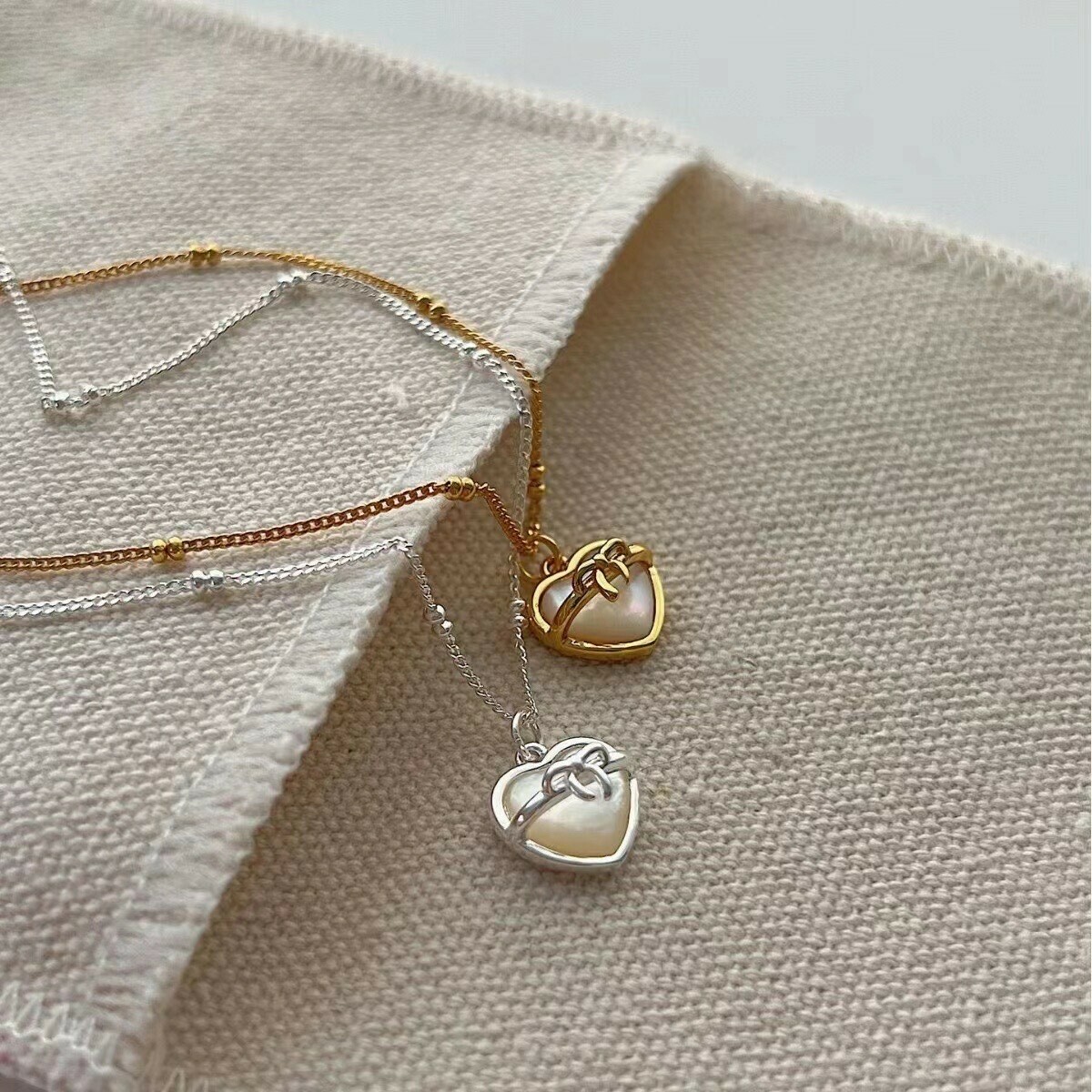 T48愛心蝴蝶結白貝石純銀鎖骨鏈