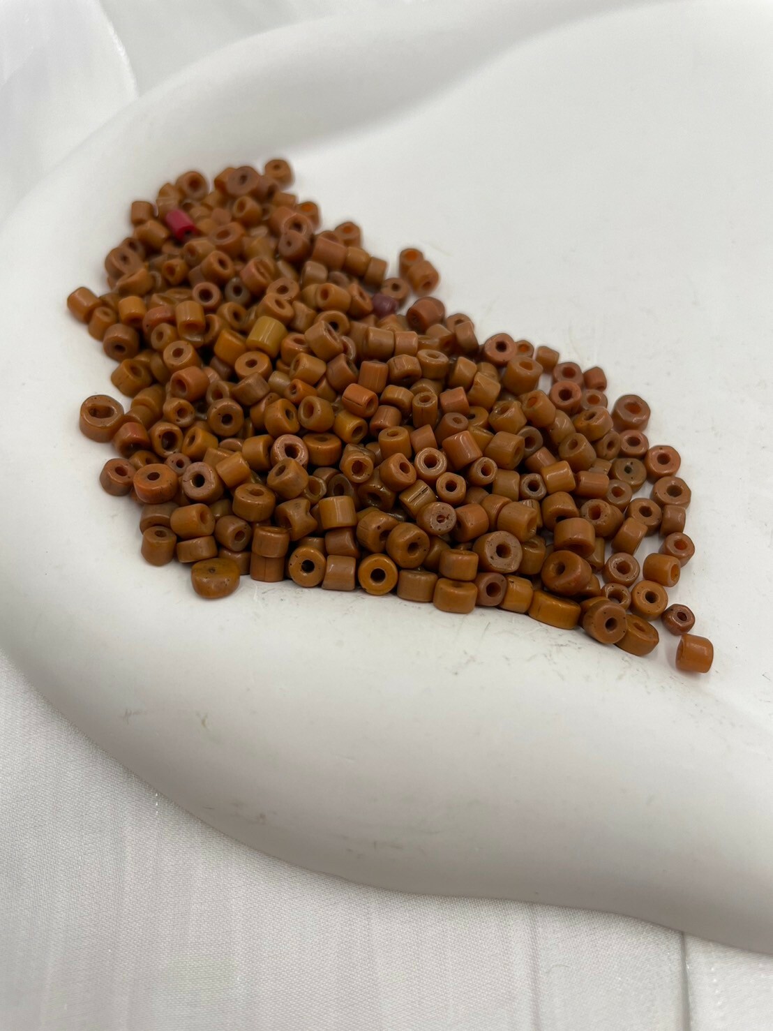 公克-貿易古管橘珠3mm長2mm孔1.5mm