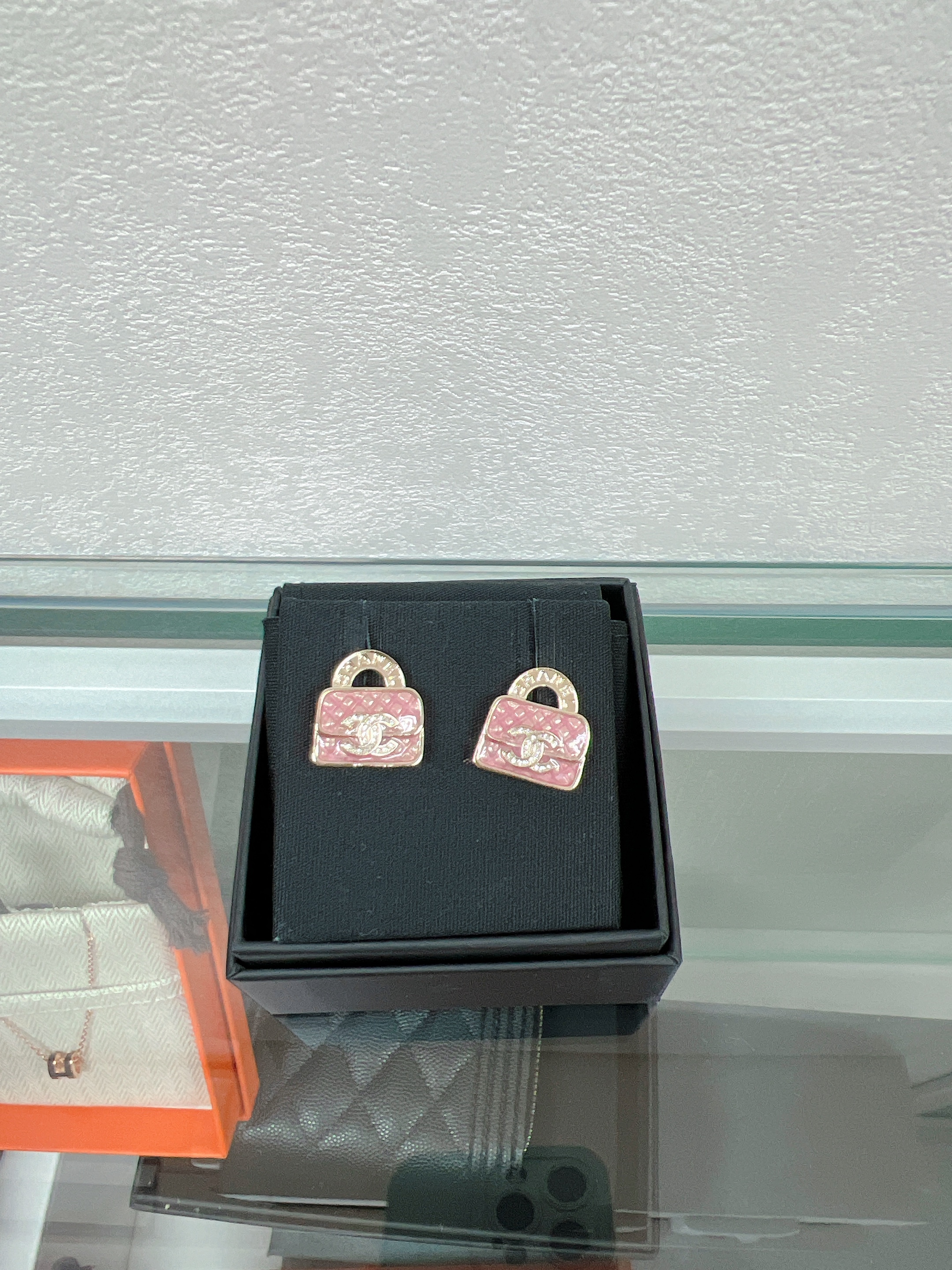 Chanel earrings 24s pink handbag