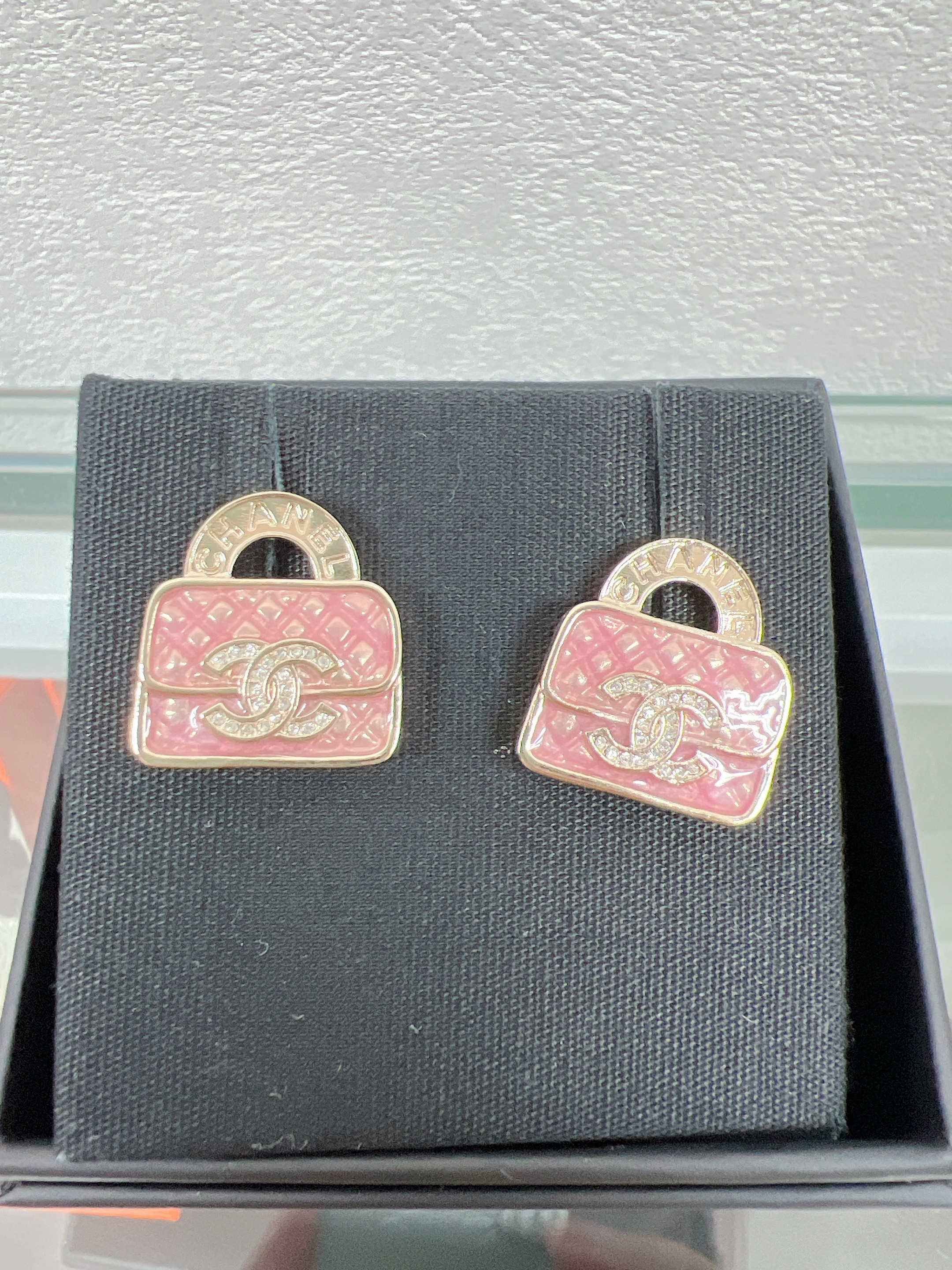 Chanel earrings 24s pink handbag