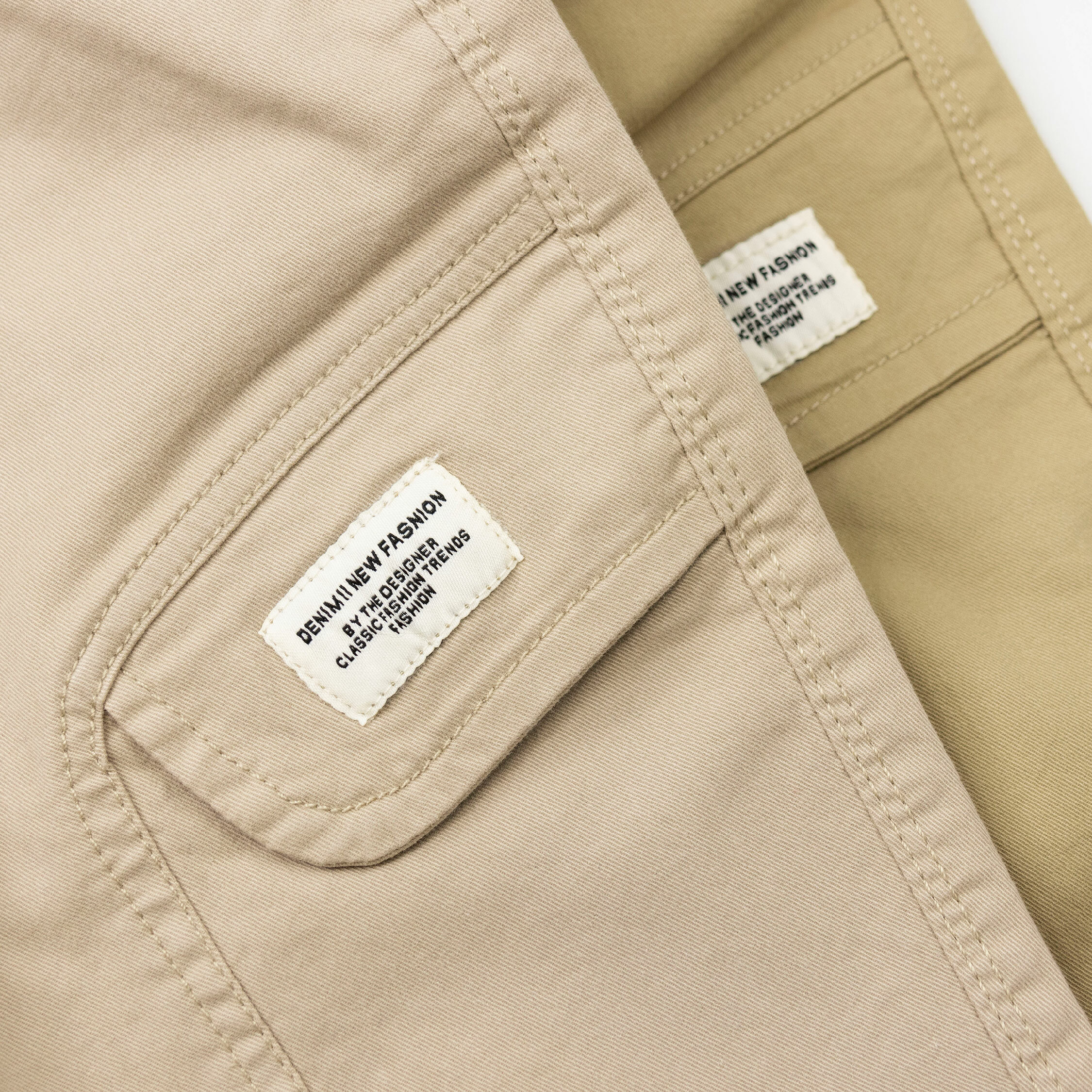 【H35643】極簡大地色造型布標休閒褲