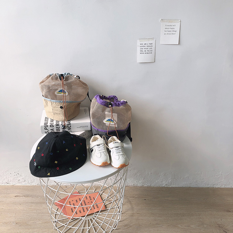 拼接網眼束口斜背包