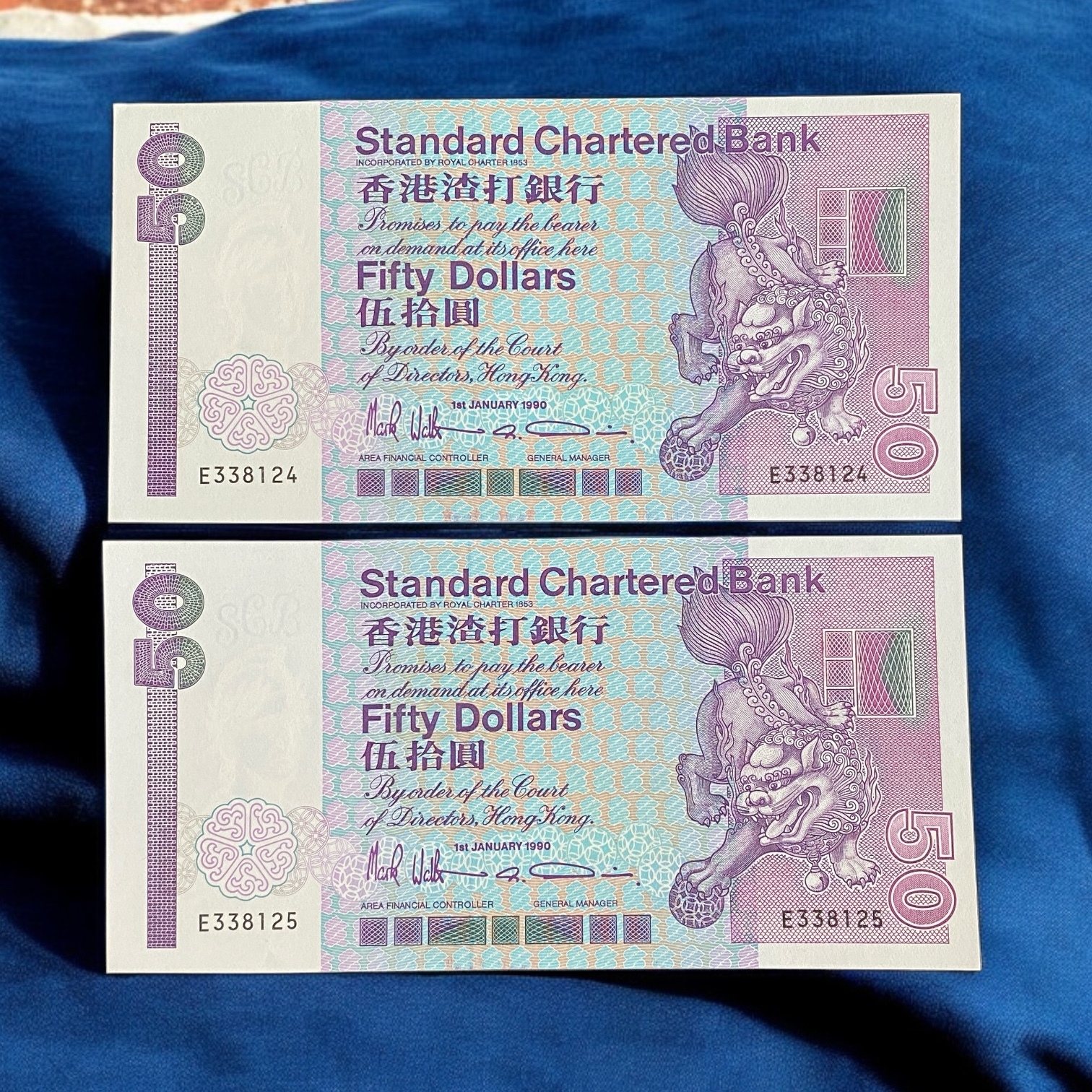 1990 Standard Chartered Bank $50 Lion Dance E Series, Prefix rides two years (UNC Condition) E 338124-25