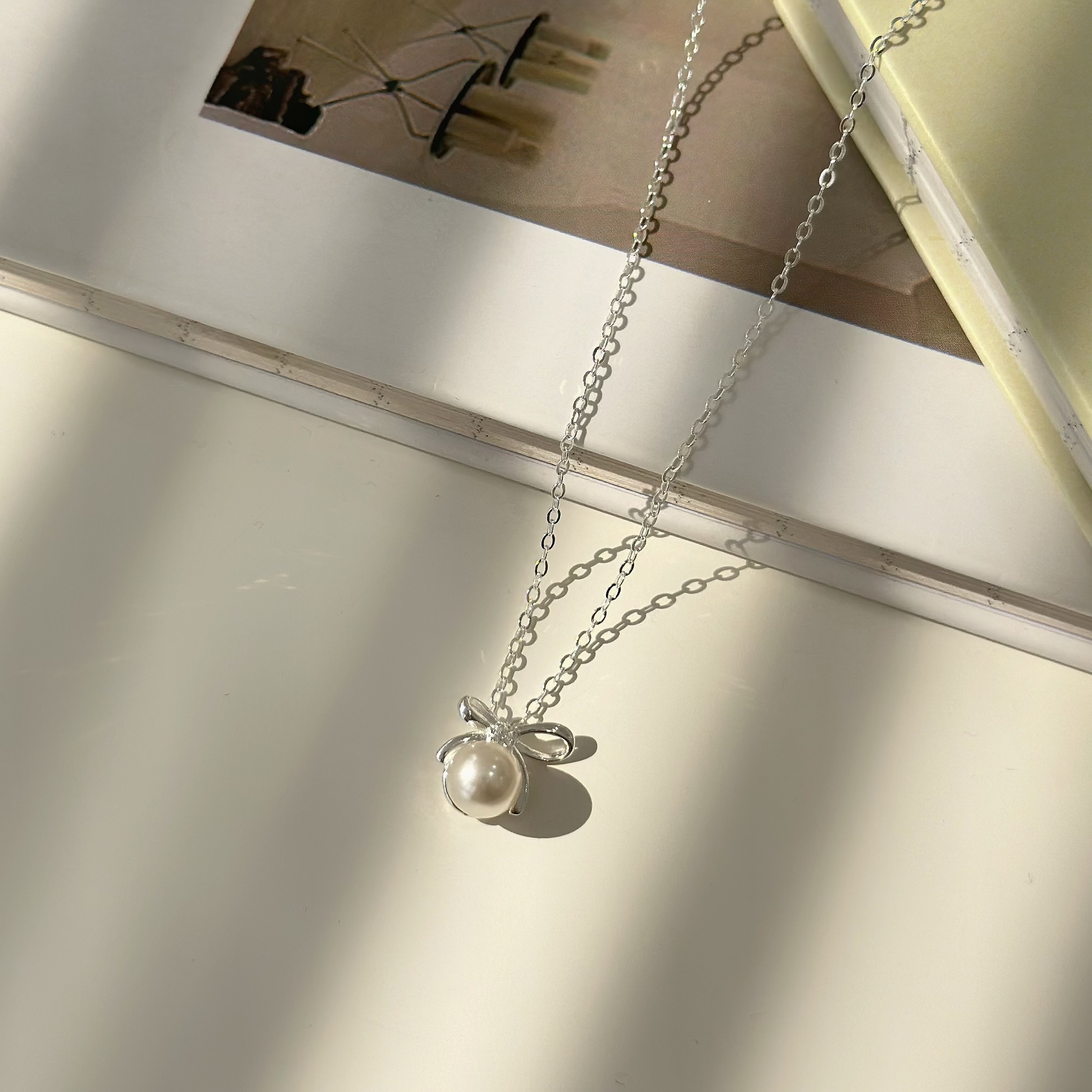 迷人．蝴蝶結珍珠純銀項鍊