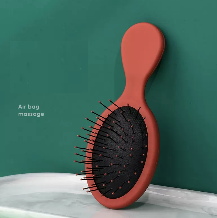 Popular women's portable airbag massage comb (orange, nylon teeth) (size: length 14cm, width 5.8cm)