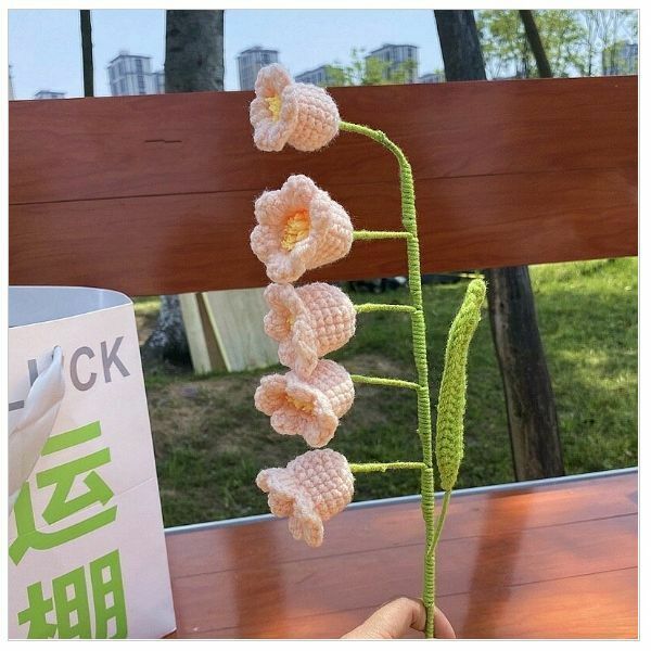New wool hand-knitted crochet flower product (a skin-colored lily of the valley flower)