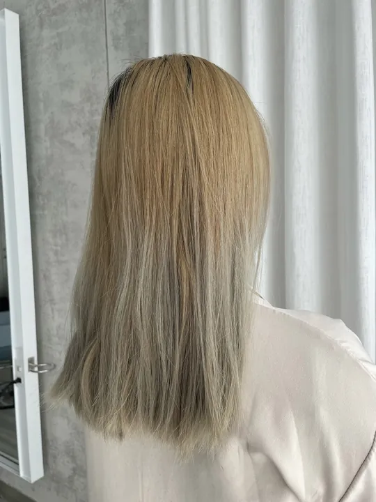 The model's hair showed a slight green tint after the color faded.