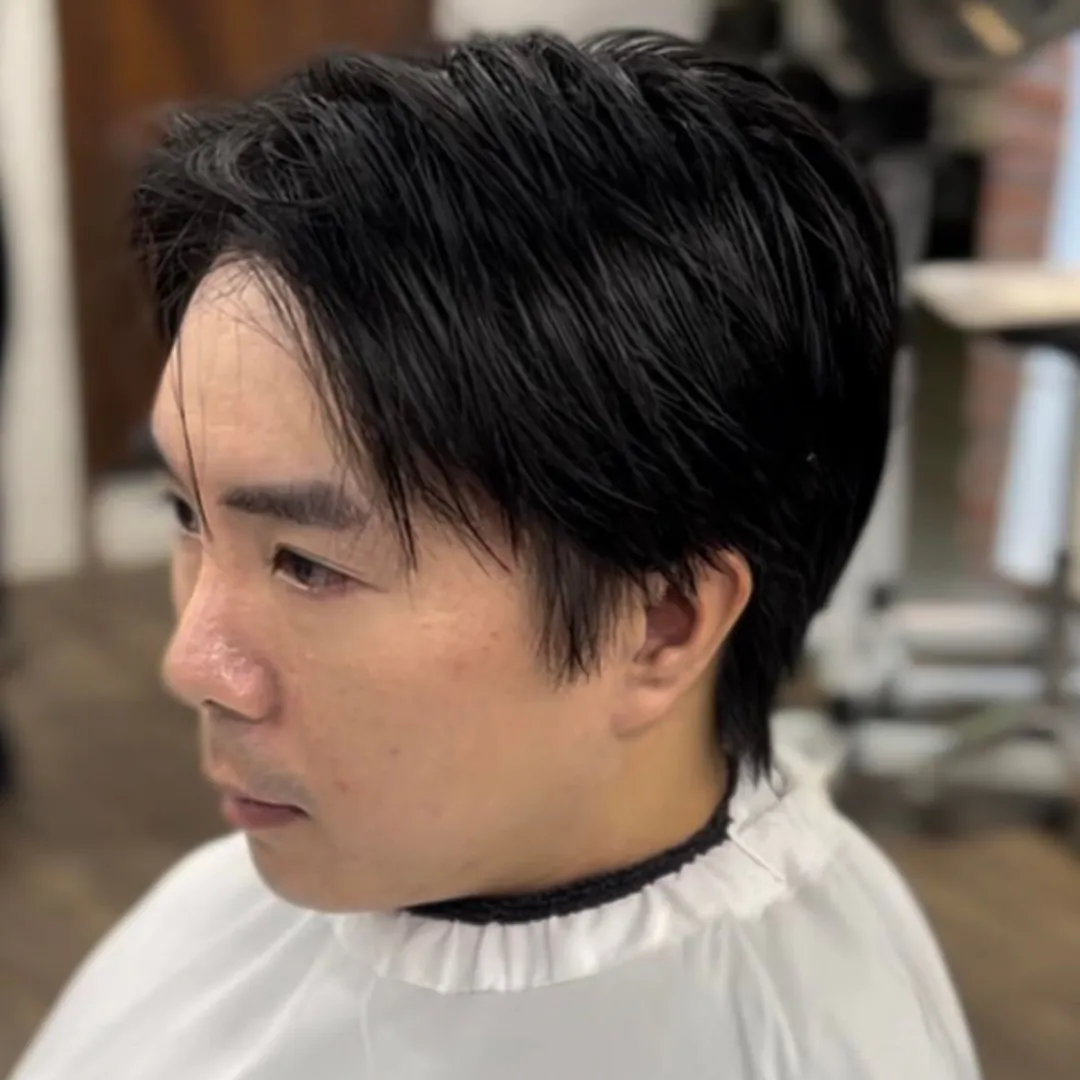 Nick showcases his Pressed Perm work, making the hairstyle more effective and polished.