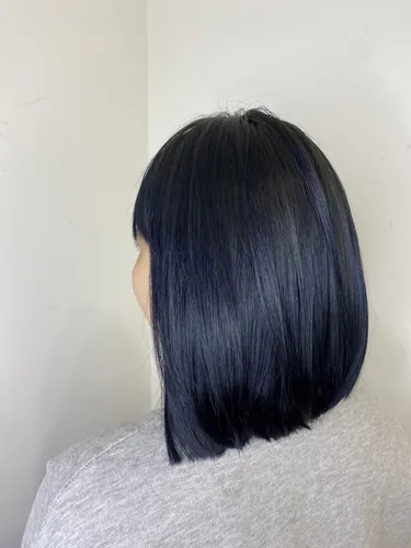 Blue-black with only the hair ends bleached.