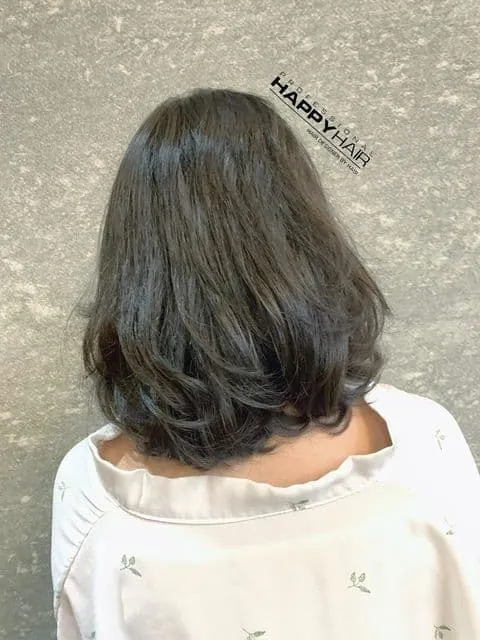 The curls are concentrated at the ends, with an irregular wave pattern that isn't messy but still easy to manage.