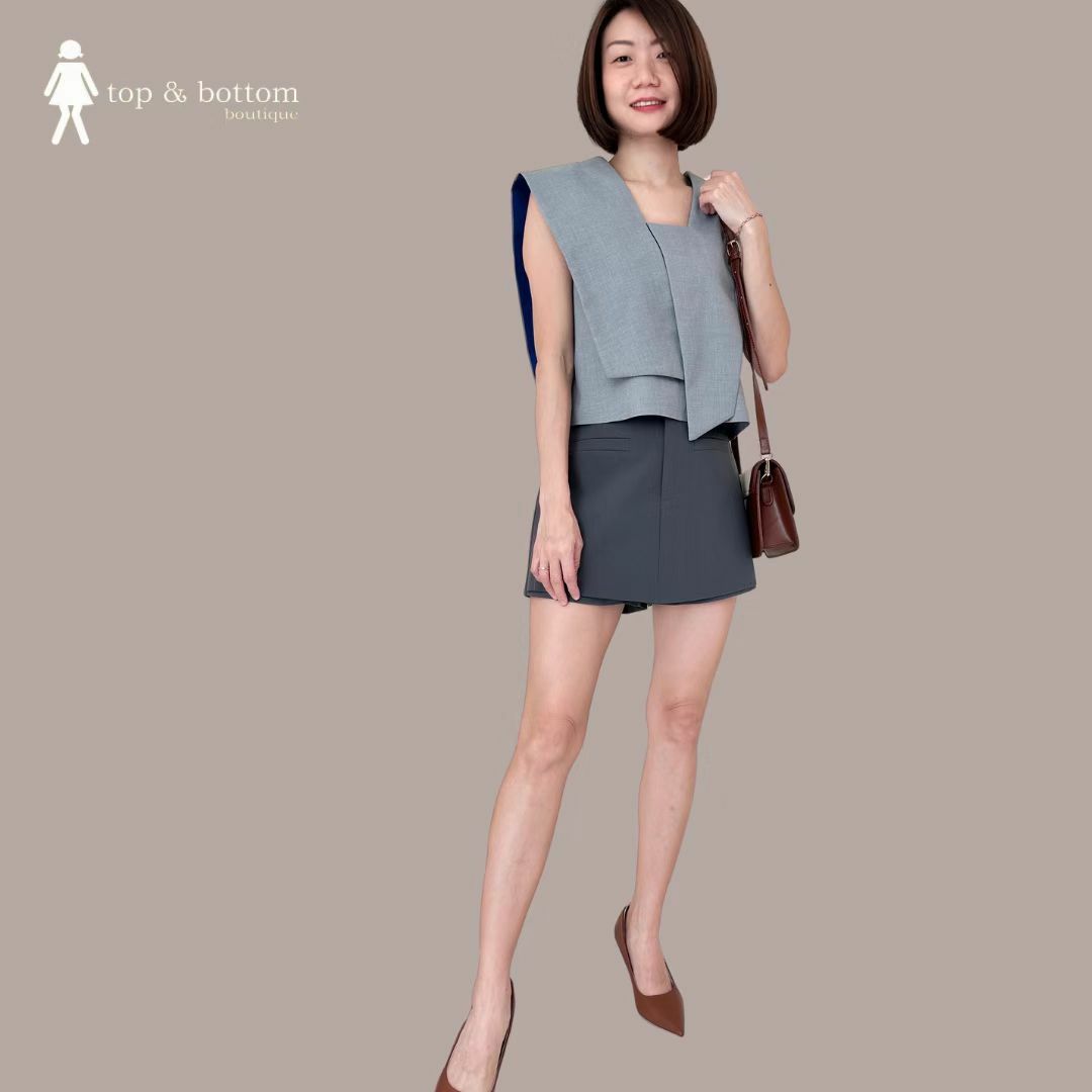 SOLID ASYMMETRIC CROP BLOUSE