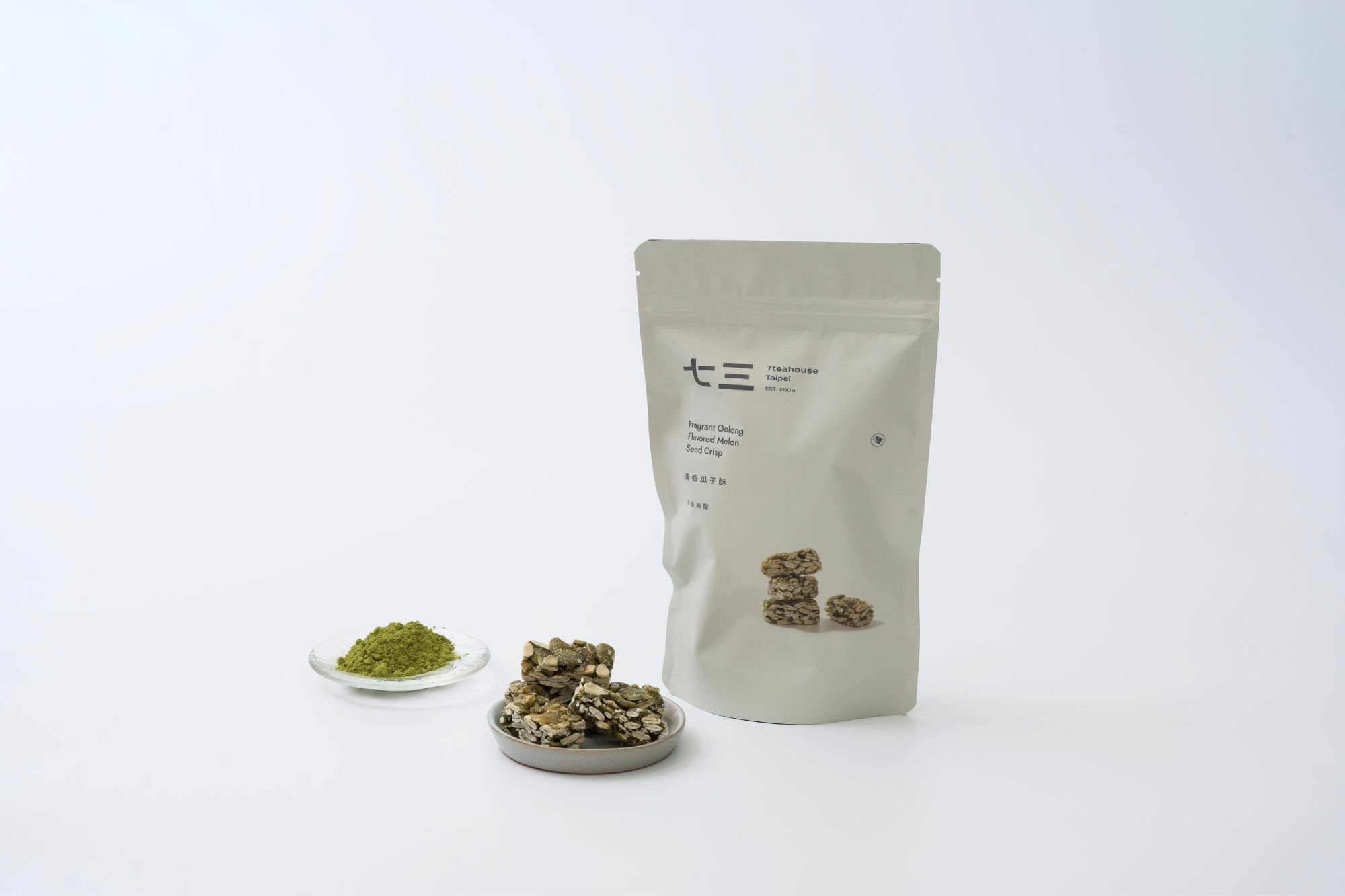 畫面裡,有一疊清香烏龍茶粉、清香瓜子酥與清香瓜子酥-清香烏龍商品 夾鏈袋。