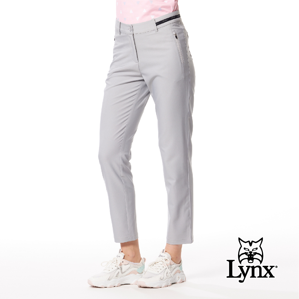 【Lynx Golf】彈性舒適夜光織帶膠印拉鍊口袋窄管九分褲