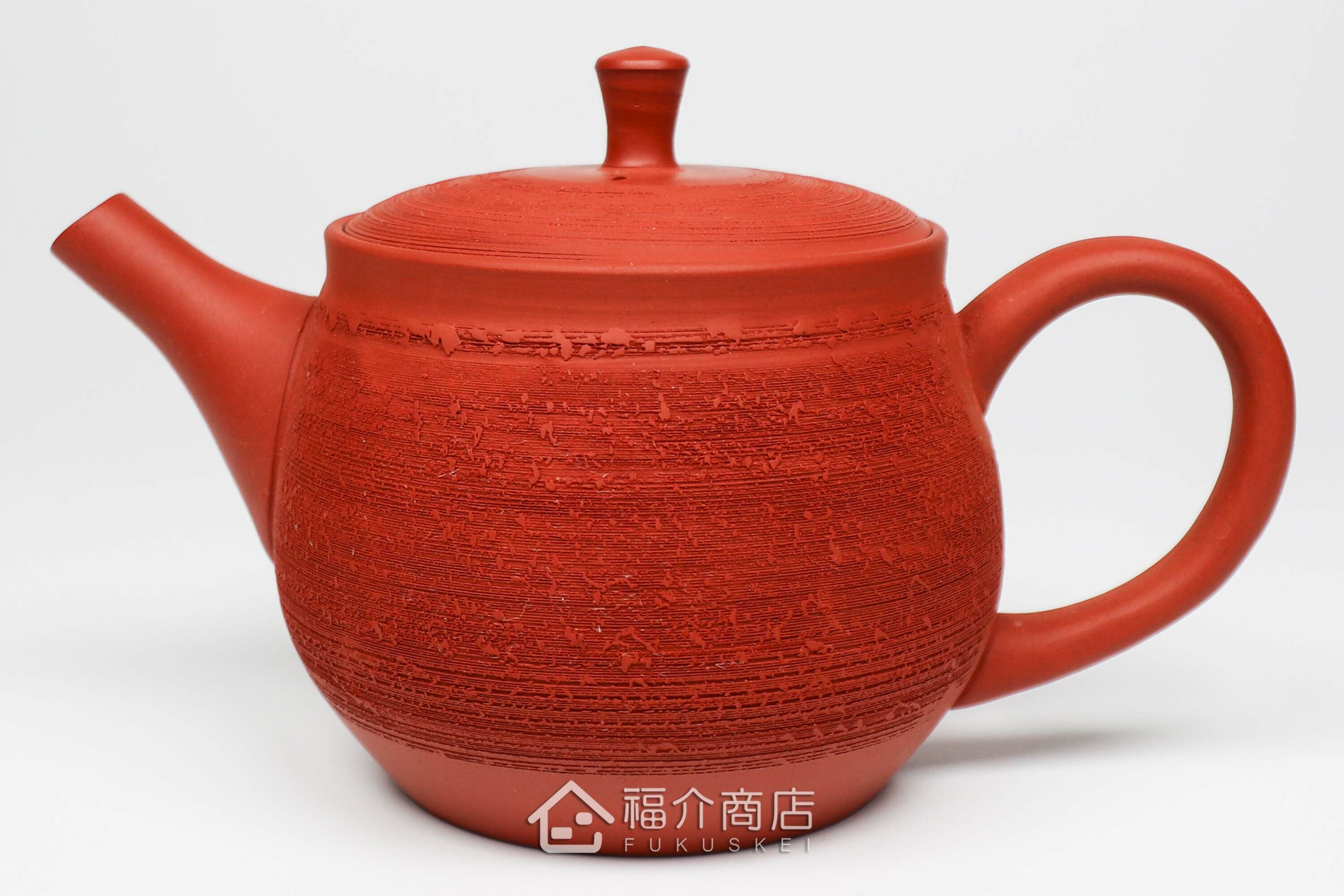 泡茶用的松皮造型朱紅色日本陶壺