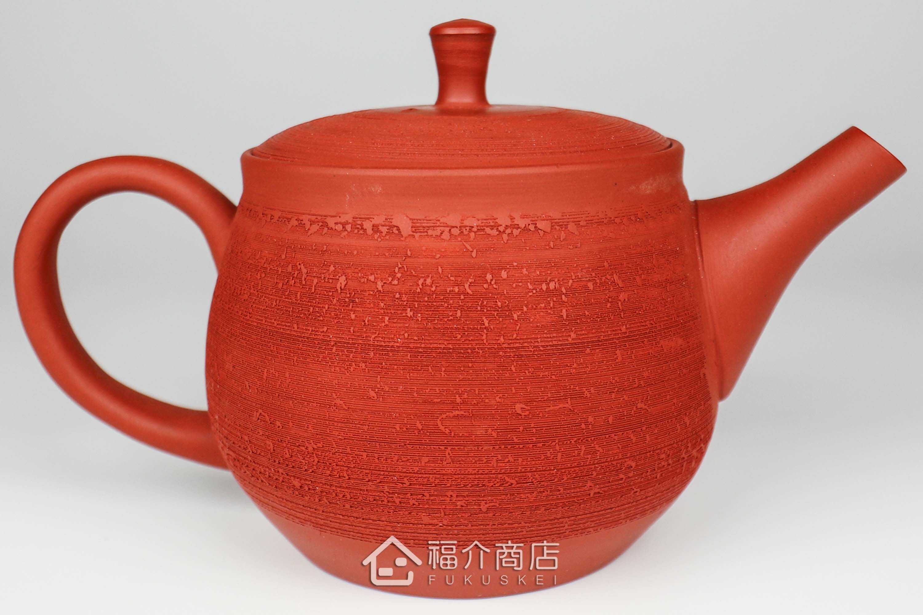 泡茶用的松皮造型朱紅色日本陶壺