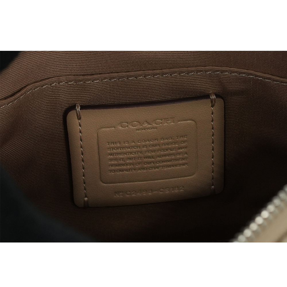 【COACH】Rowan 塗層帆布及再生皮革拉鍊迷你斜背包(淺卡其/粉橘色)CS182 SVX1W