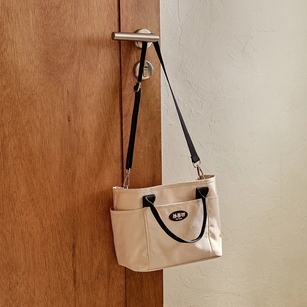 DOT家族福音立體萌趣人物系列-解放媽咪雙手超輕便攜尿布包