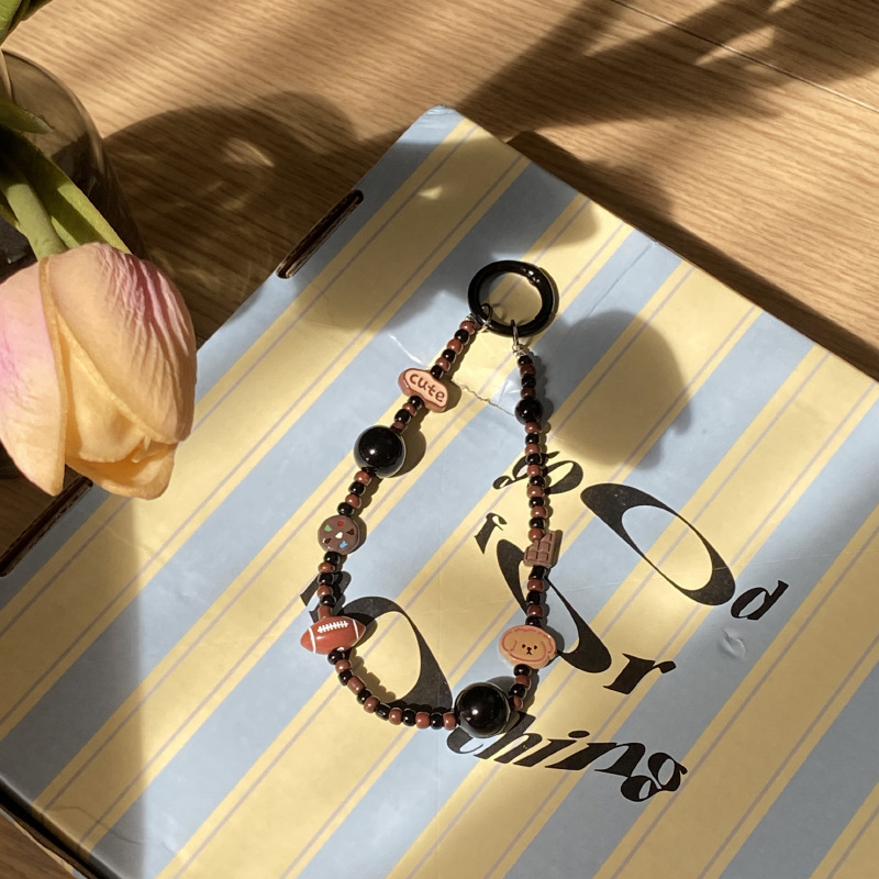 《5207》可愛咖啡橄欖球小狗手機掛繩