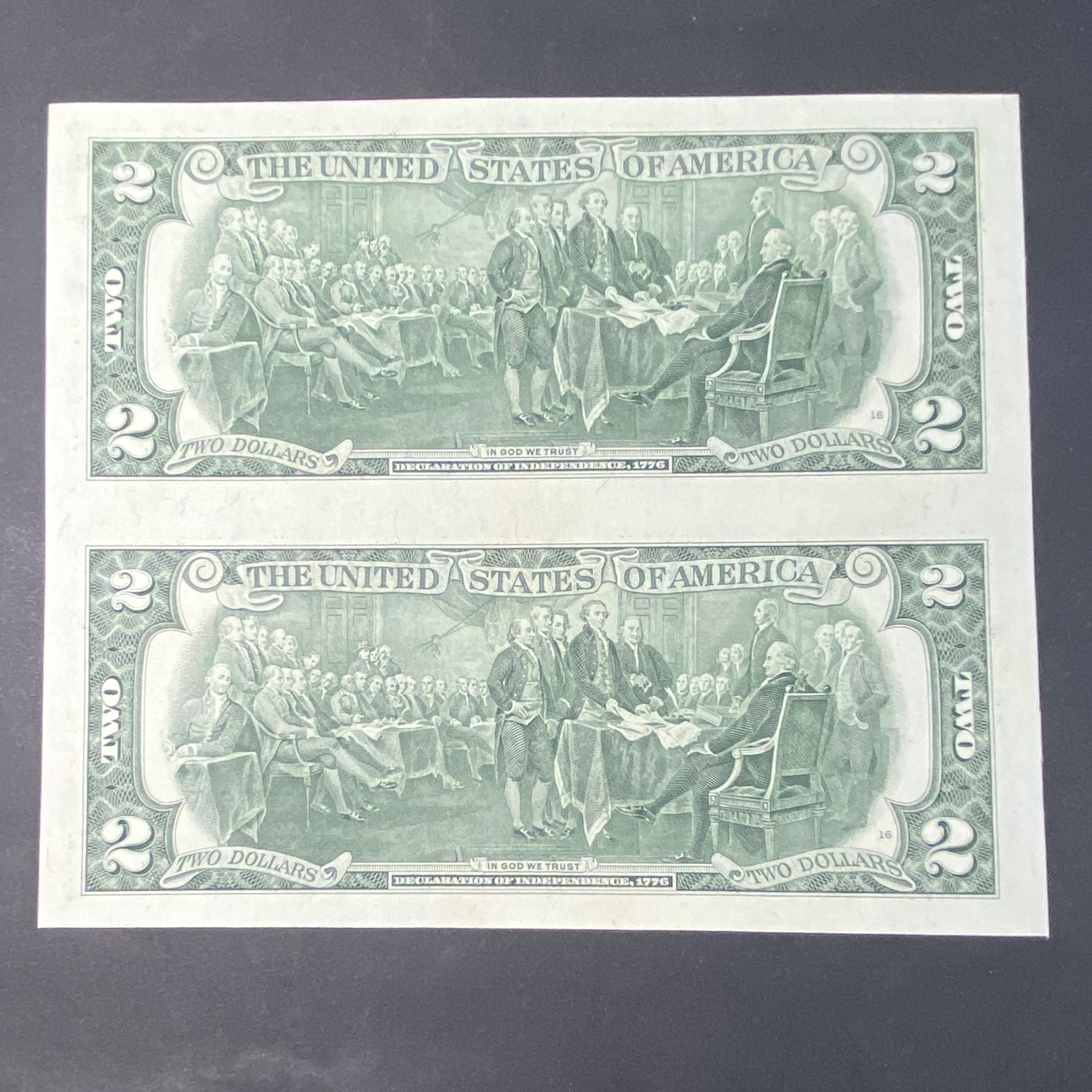 1995, two United States uncut two-dollar bills pair (AU-UNC condition) with serial numbers F9949027C and F99519027C