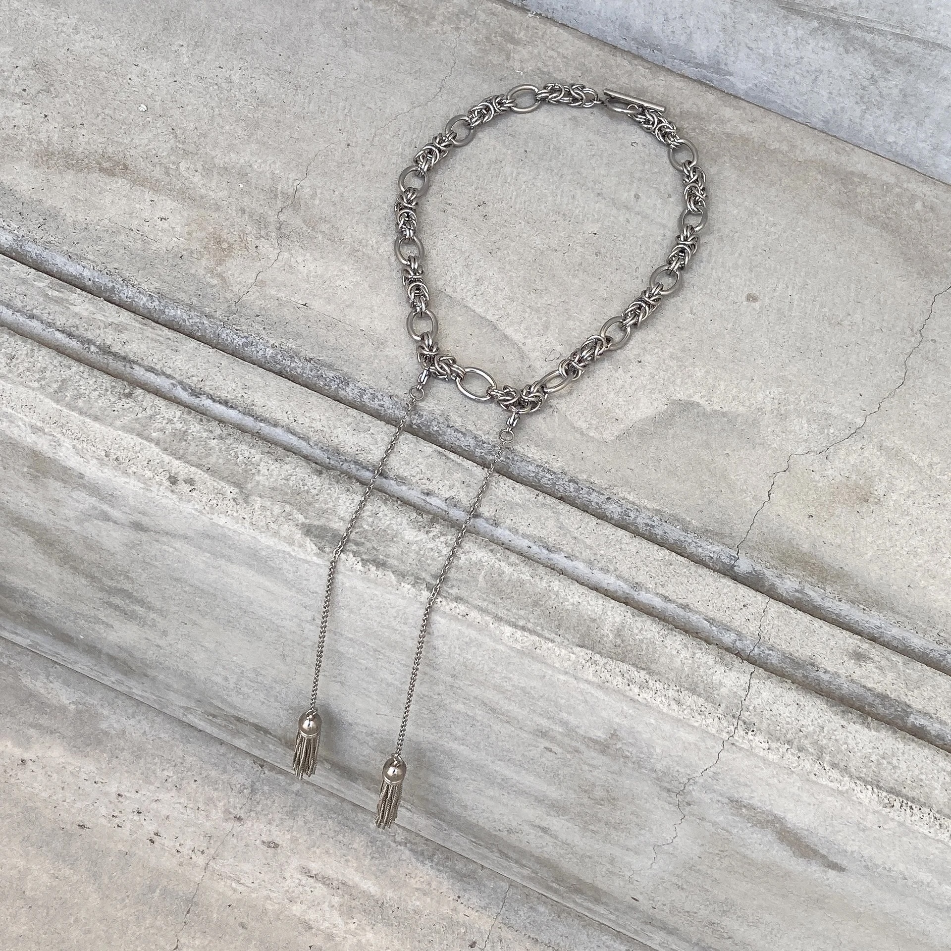 [LAUGHTER] double tassel necklace