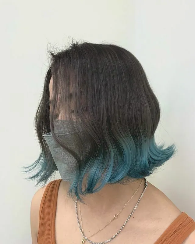 MIM Salon Stylist Work: Shoulder-length short hair with aqua green dye applied only at the ends.