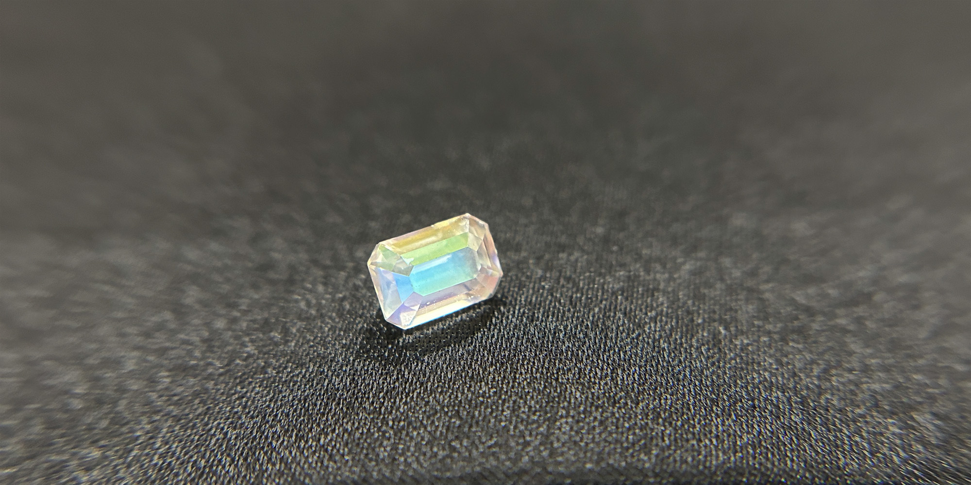 A 1.07 carat emerald cut of moonstone featuring an orange flash effect.