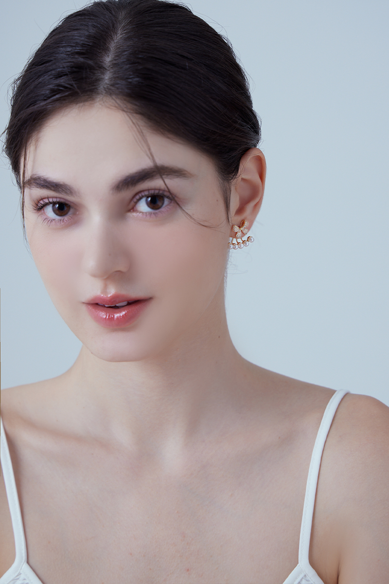 優雅蝴蝶結珍珠。針式耳環