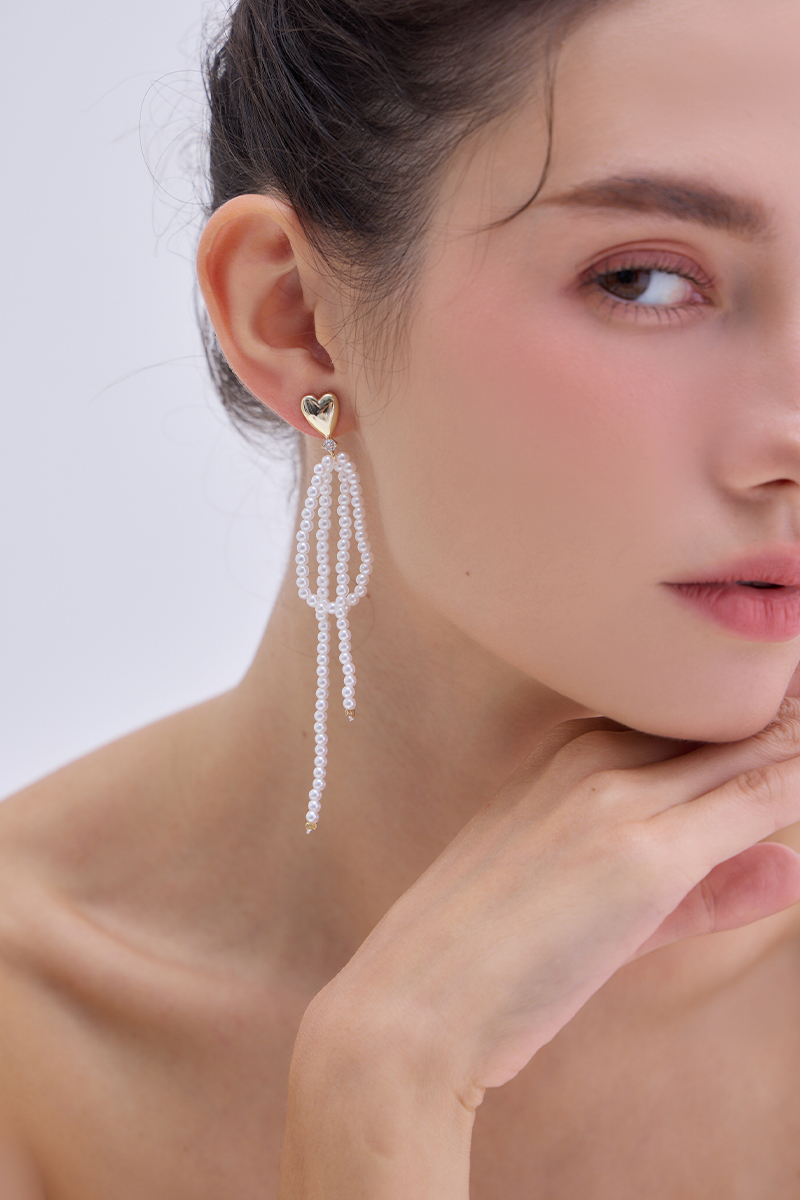 愛心珍珠流蘇。銀針耳環