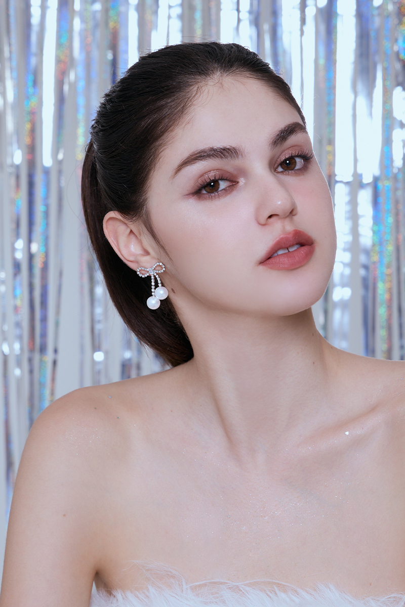 鑽石蝴蝶結珍珠。銀針耳環