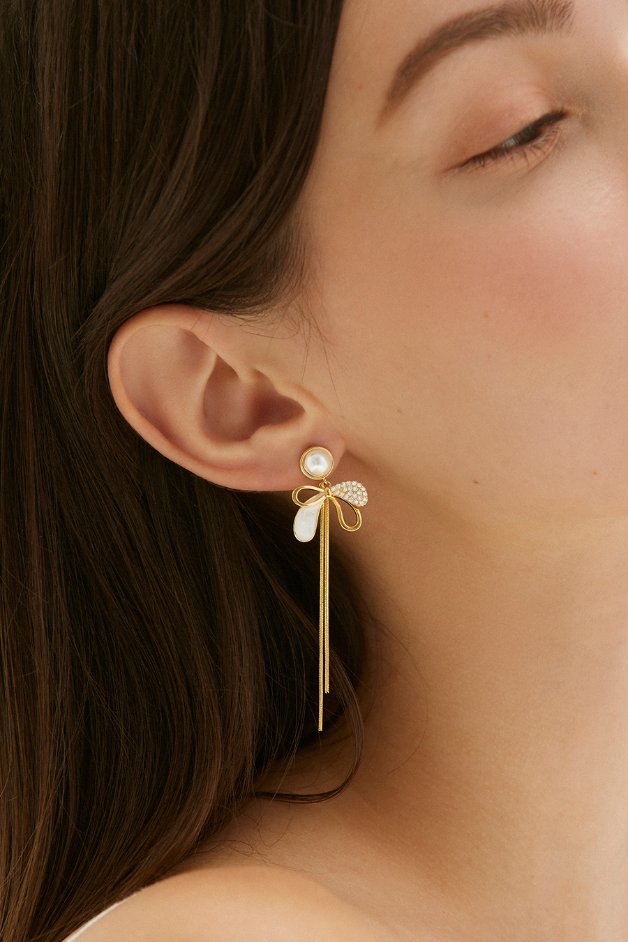 拼接蝴蝶結垂墜。銀針耳環