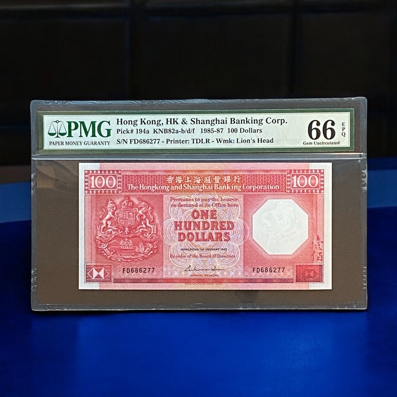 1987 HSBC Banknote, $100 Octagonal Red (UNC condition) with PMG grade of 66, FD686277