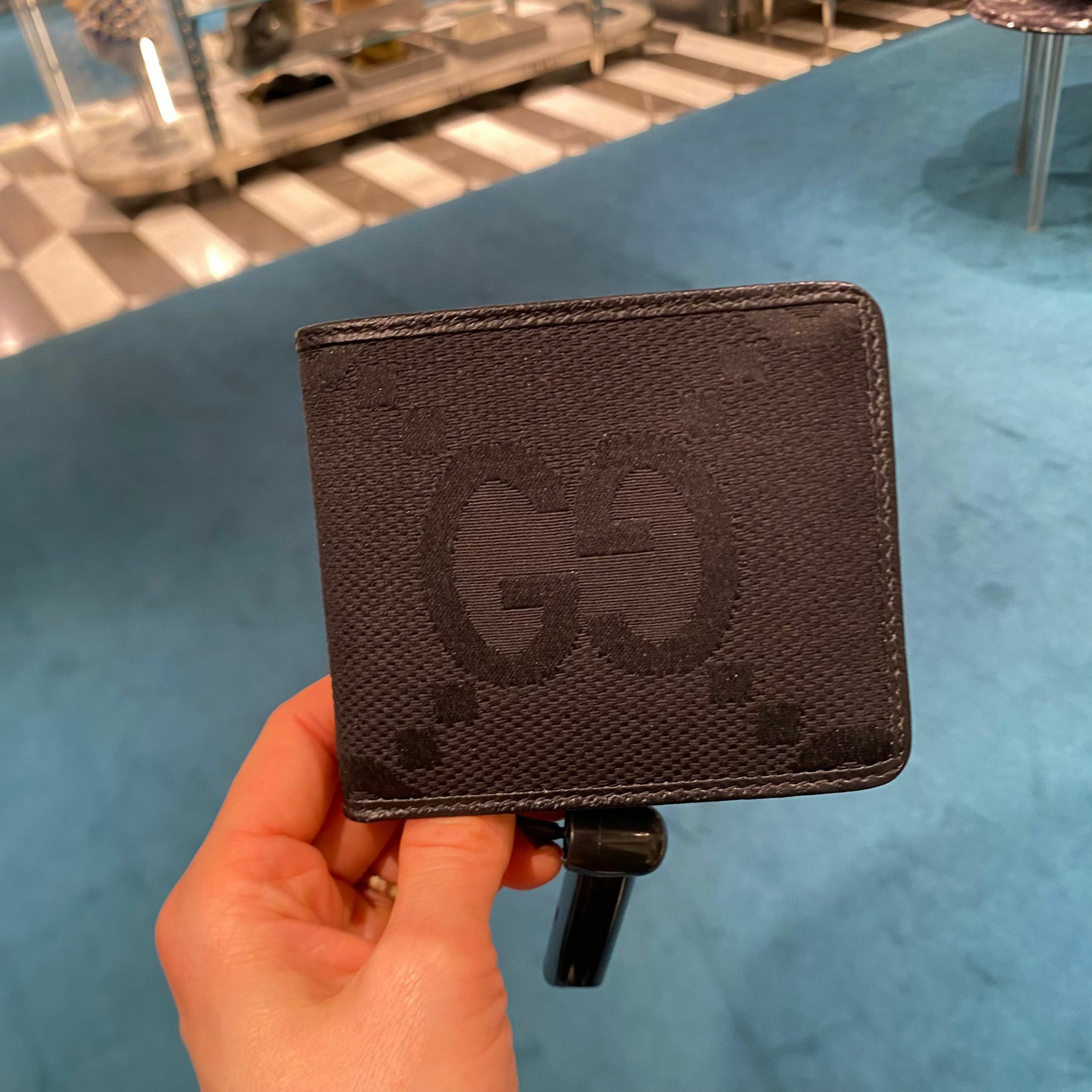 Gucci Jumbo GG canvas dollar bi-fold wallet in black