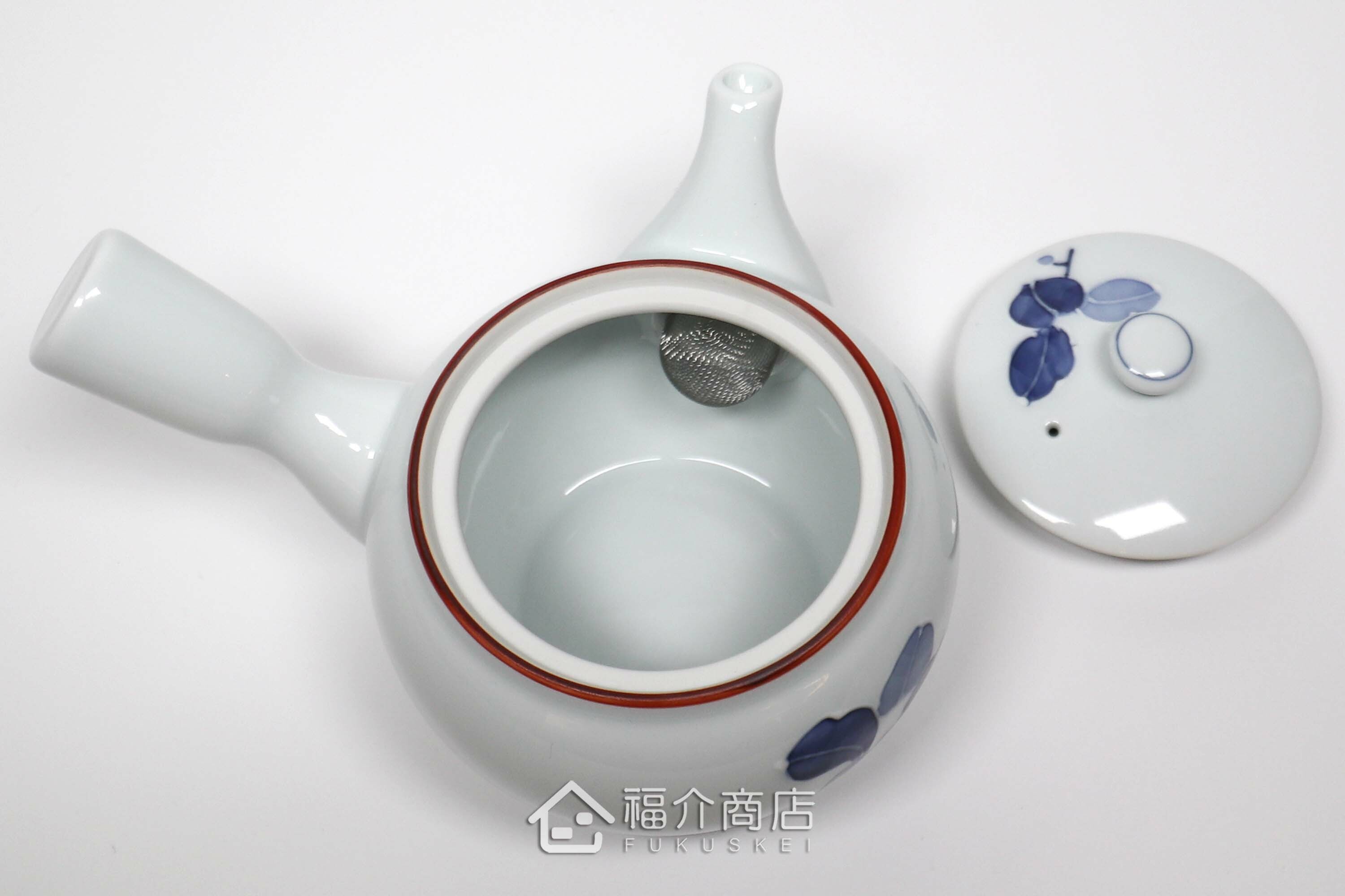 泡茶用的400㏄白色陶茶壺上面有青色花瓣造型