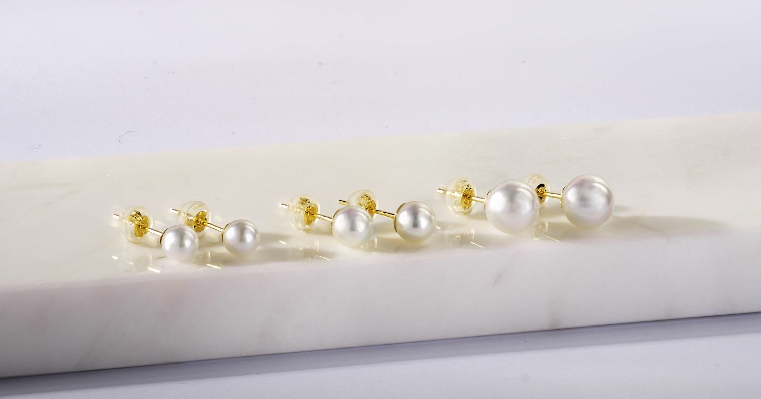 18K yellow gold Akoya pearl earrings in various sizes.